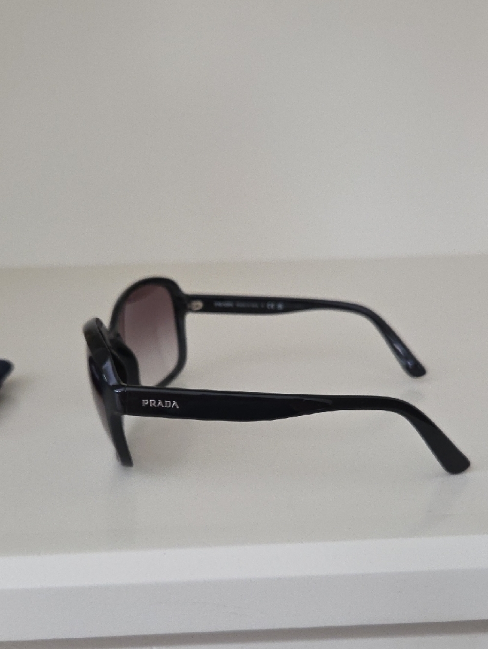 Prada Women’s Black Frame Sunglasses with Smoky Lenses - Picture 2 of 6